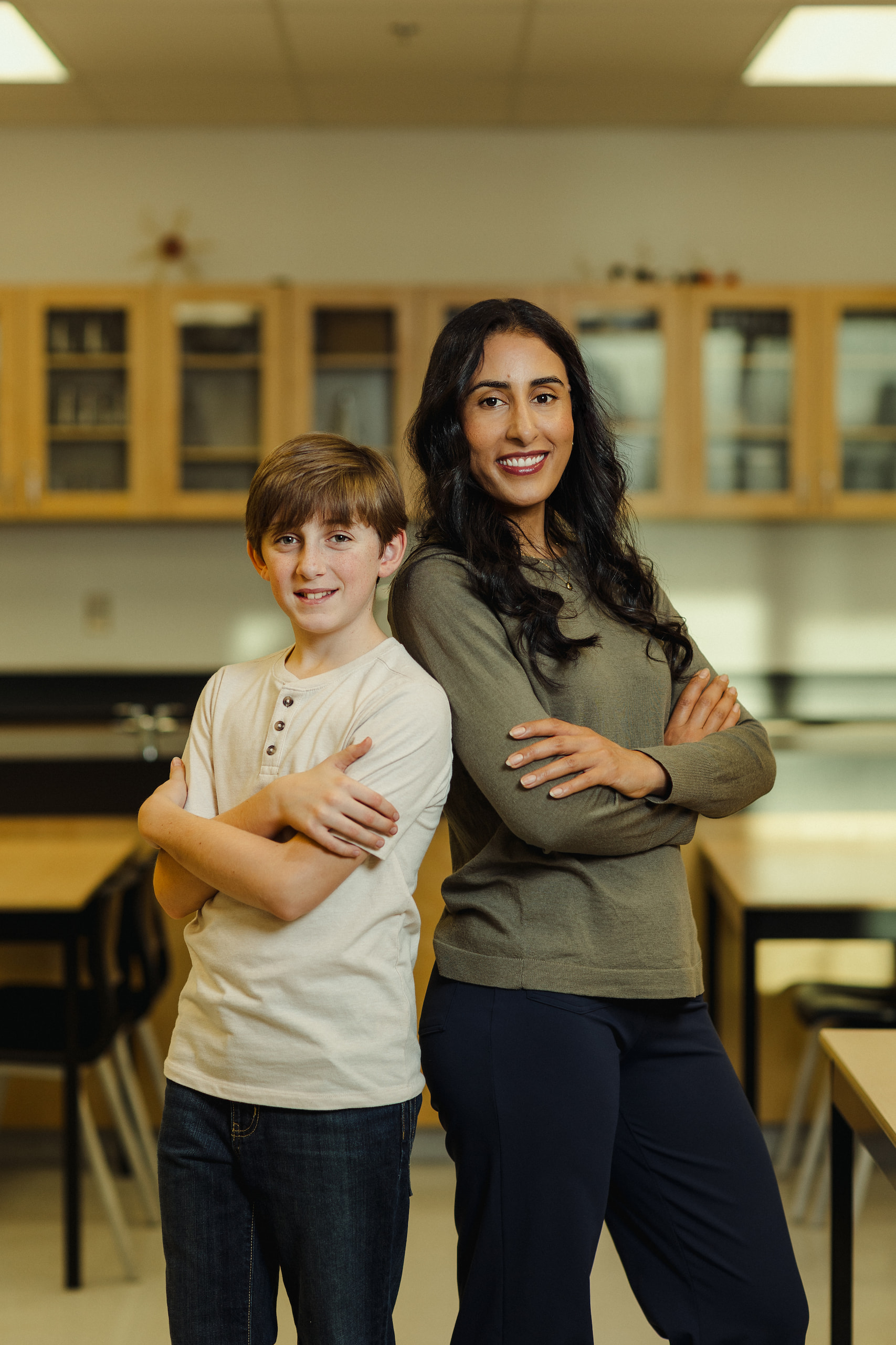 A photo of Madame Khadija smiling with a student.