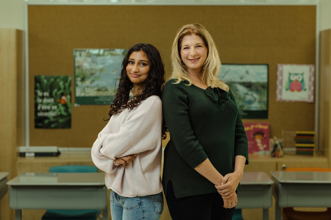 A photo of Madame Anne smiling with a student.