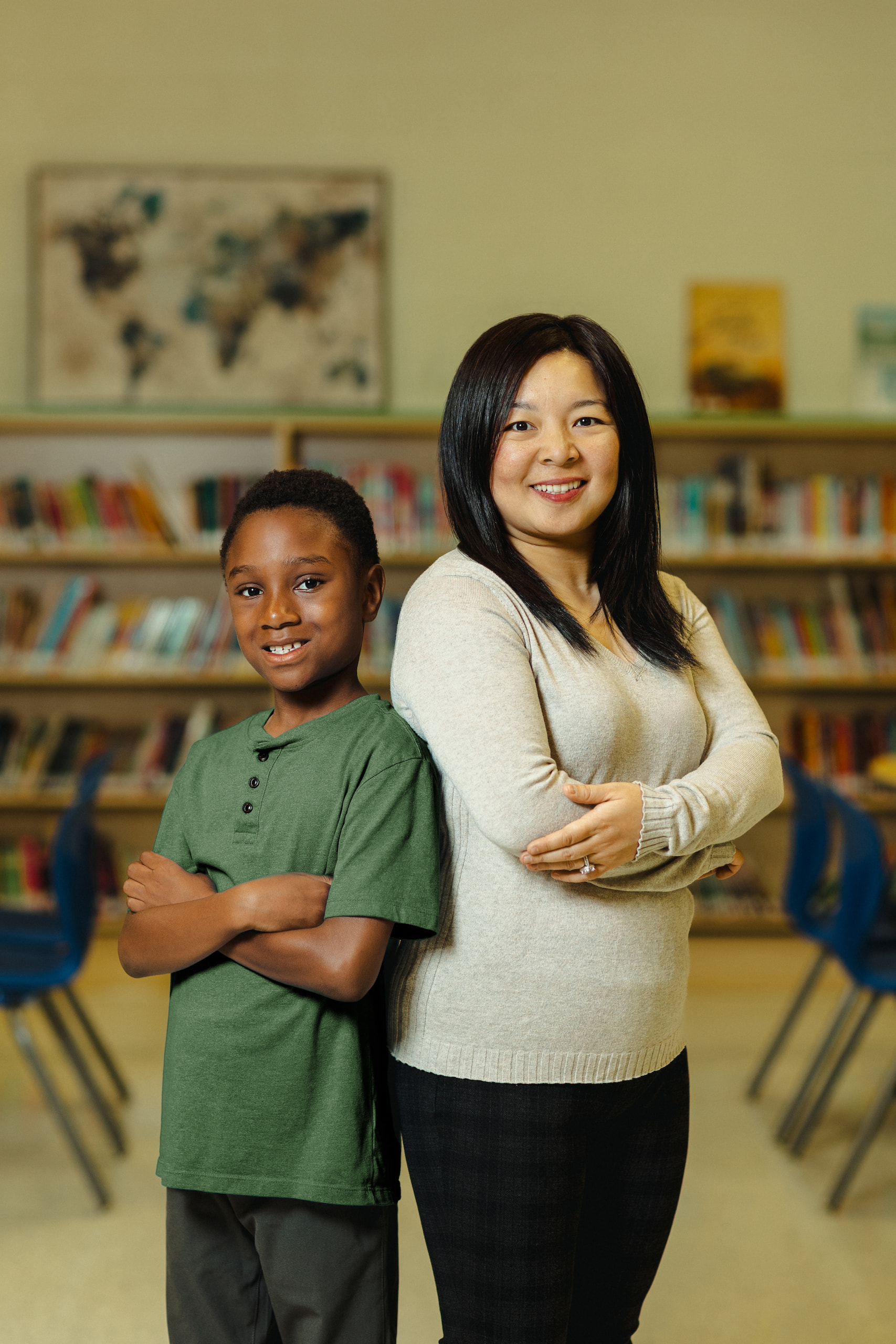A photo of Madame Gigi smiling with a student.